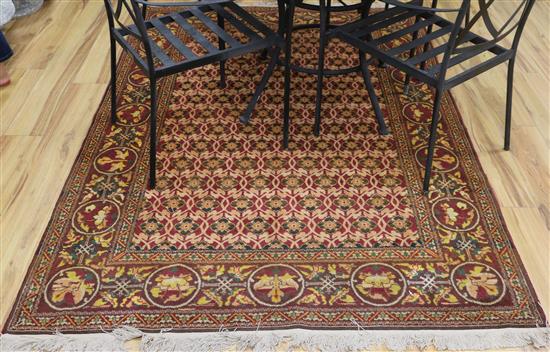 An Afghan red ground rug 216cm x 146cm